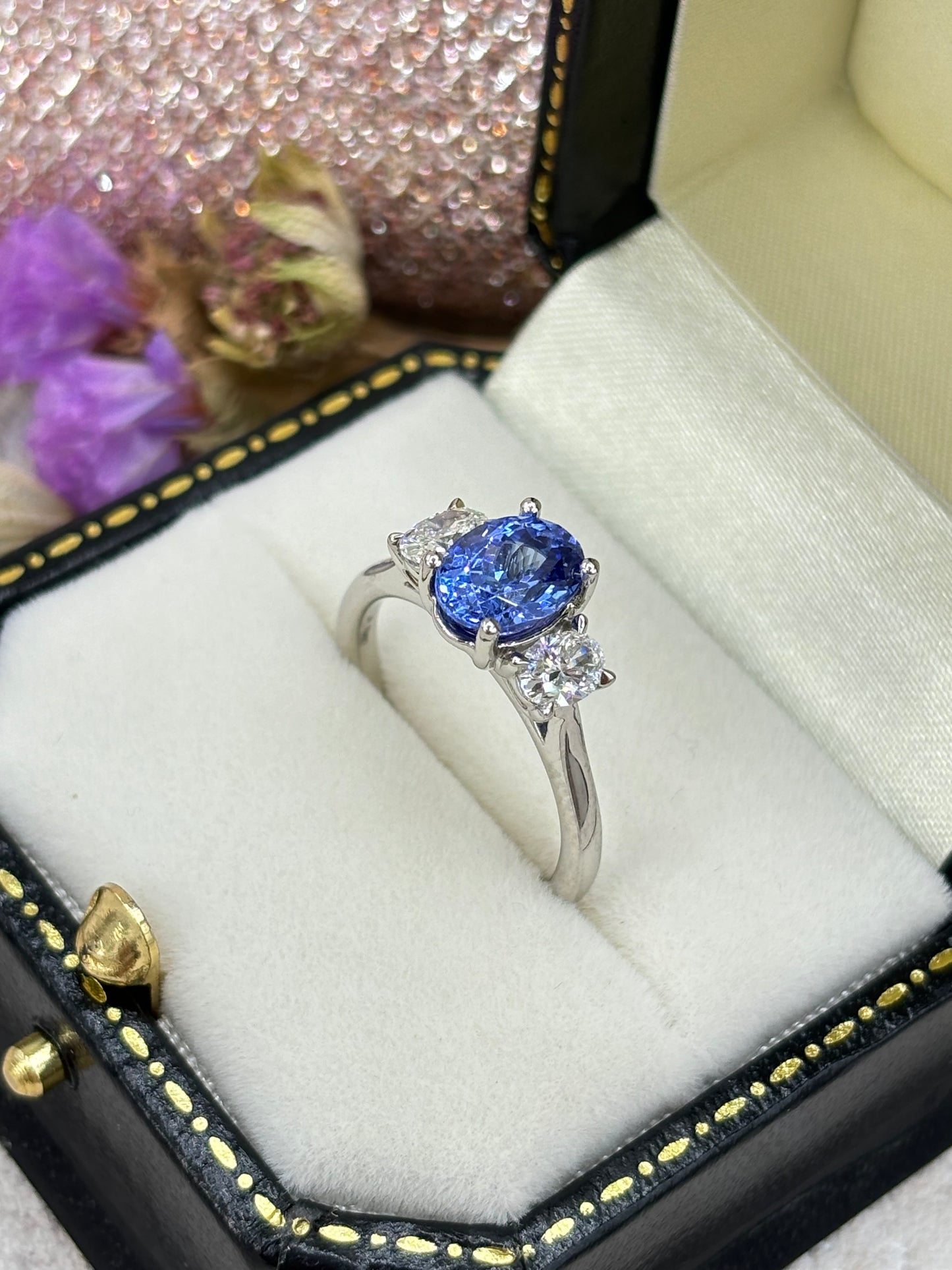 Platinum Oval Tanzanite and Diamond Three Stone Ring.