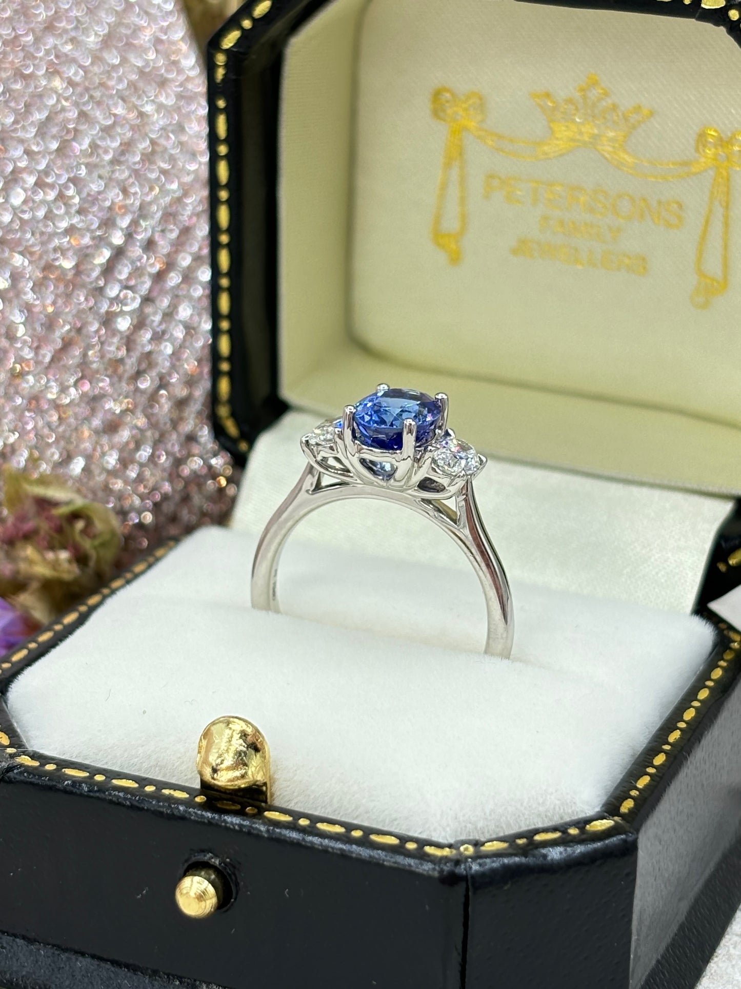 Platinum Oval Tanzanite and Diamond Three Stone Ring.